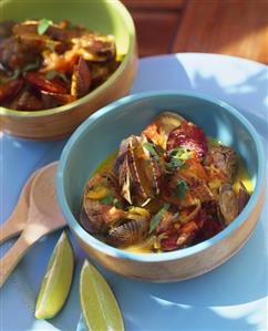 Clam soup with coconut milk and chorizo