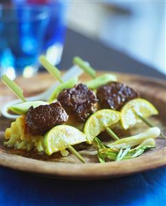 Grilled skewered meat with potato salad