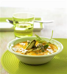 Carrot soup with goat's cheese and green asparagus