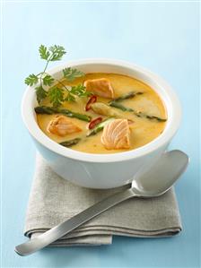 Red curry soup with salmon and asparagus