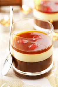 Layered chocolate & vanilla dessert with liqueur cherries