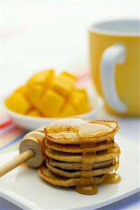 Pancakes with honey and mango