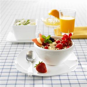 Muesli with fruit, orange juice and herb quark