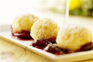 Curd cheese dumplings with apple and damson compote