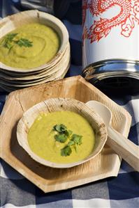 Avocado soup in wooden bowls