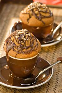 Chocolate muffins in cappuccino cups