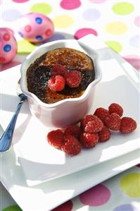 Baked chocolate cream with raspberries