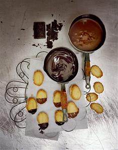 Coating bear paw cookies with chocolate