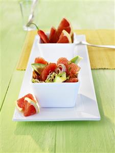 Avocado and grapefruit salad in china bowls