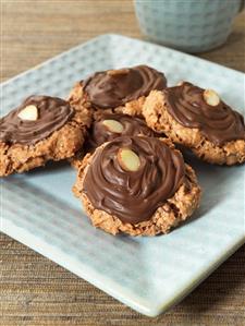 Nut macaroons with chocolate icing