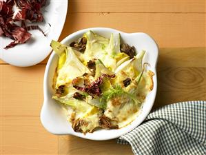 Fennel and mango gratin in a baking dish