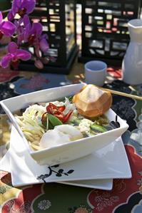 Japanese noodle soup with vegetables out of doors