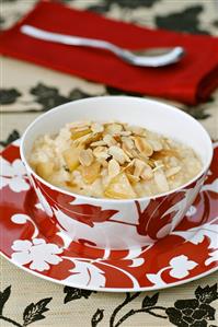 Rice pudding with apple, mascarpone and flaked almonds