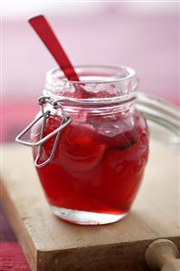 Apple and cranberry jelly in a preserving jar