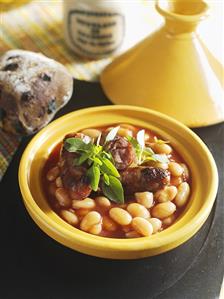 Tomato and bean stew with sausages in a tajine