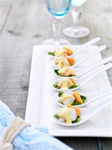 Spiny lobster with papaya on china spoons