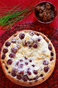 A cherry cake on a cake plate