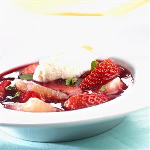 Strawberry and grapefruit soup with mint and cream