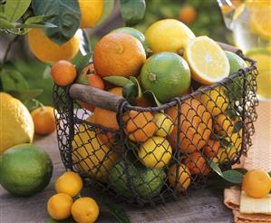 Basket of assorted citrus fruit out of doors