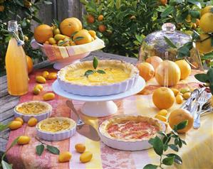 Several puff pastry tarts with citrus fruit fillings, outdoors