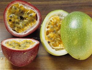 Halved purple granadilla and granadilla (passion fruit)