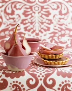 Chocolate tarts with pears in red wine