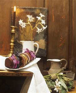 Still life: chocolate roll with ribbons and bows