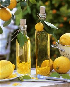 Home-made lemon oil in two bottles out of doors