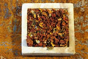 Dried gardenia fruits on a stone slab