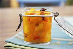 Pumpkin and orange chutney in a preserving jar