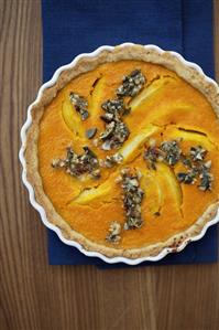 Pumpkin and pear tart in a tart dish