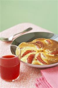 Grapefruit gratin with vanilla cream, dusted with cocoa