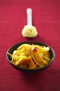 Sautéed mango with ginger in a small dish