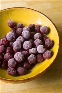 Frozen sour cherries in a ceramic bowl