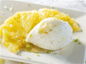 Fresh goat's cheese ice cream on fried pineapple with ginger