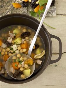 Chick-pea stew with dried fruit in a pan