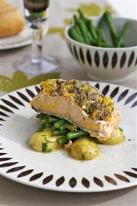 Salmon with citrus fruit cooked in foil, potatoes, beans