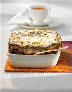 Cherry and poppy seed pudding in a baking dish