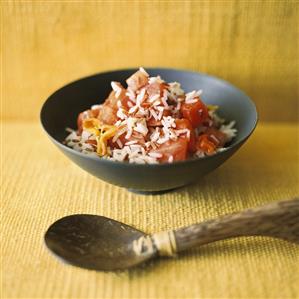 Rice and watermelon salad with chilli, wooden spoon