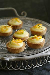 Lemon tartlets on a cake plate