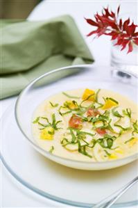 Cold coconut fruit soup with mint