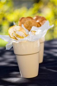 Fruit crisps in two beakers