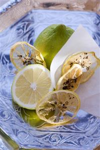 Fresh lemons and dried lemon slices