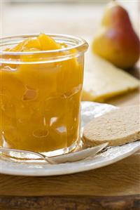 Mango & ginger chutney in a jar with oat biscuit, cheese, pear