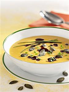 Pumpkin soup with pumpkin seed oil and chives