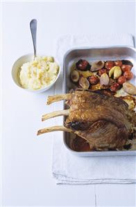 Rack of veal in a roasting tin with lemon mashed potato