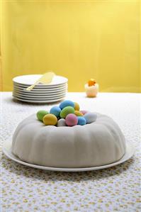 Iced ring cake with chocolate eggs