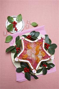 Star-shaped cake with candied fruit for Christmas