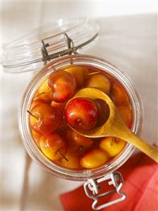 Cherries in alcohol in a preserving jar