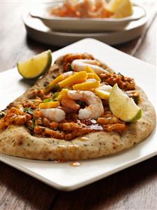 Naan bread with mango curry and prawns